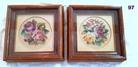 Pair of petit point floral needlework pictures framed in wooden 7x7 inch frames. Each picture shows detailed tiny stitched flowers in circular format.