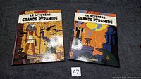 Two hardcover comic albums titled 'Le Mystere de la Grande Pyramide' showing colorful covers with Egyptian-themed illustrations.