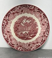 Front view of 15.5 inch round vintage English ironstone platter with red transferware scenic Vista pattern by Masons.