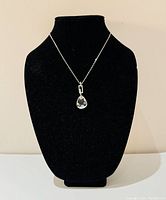 Full necklace displayed on black bust to show length and design