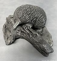 Top front angle showing textured fur detail and placement on wood-like base