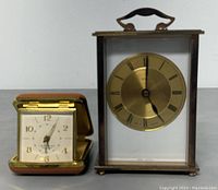 Both clocks side by side, showing size and design features