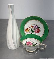 Royal Doulton white porcelain vase and Paragon teacup with matching saucer showing green band and floral decoration