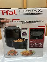 Front box image showing the T-fal Easy Fry XL Digital Air Fryer with its basket and fries, highlighting the large digital touch screen.