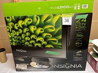 Original box of Insignia 24 inch LCD TV with DVD, showing brand name, model number NS-24LD100A13, and product specifications.