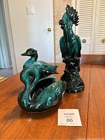 Photo showing all three Blue Mountain Pottery bird figurines together on a wooden table.