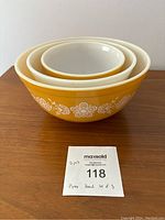 Three nesting Pyrex bowls stacked showing exterior design.