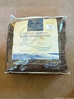 Packaged comforter set showing brand and packaging