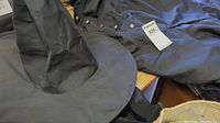 Photo of black witch hat and black dress with buttons