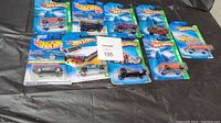Full lot of 11 Hot Wheels Treasure Hunts series die-cast cars, original sealed blister packs.