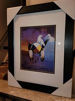 Framed Medicine Wheel print by Bradly Macdonald showing the full framed piece with protective corners on frame.
