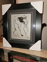 Frontal view of the professionally framed Picasso nude woman print with corner protectors on frame.