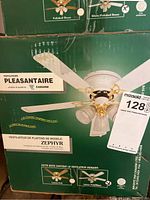 Photo of the green box of a new Canarm PLEASANTAIRE Zephyr ceiling fan, showing the product image and text.