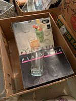 Boxes of Party Lite glasses in original packaging, one glass placed on top for display, showing classic faceted clear glass design.