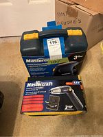 Mastercraft Detail Sander/Polisher case and box with a Mastercraft 4.8V Pivoting Cordless Screwdriver Kit box in front, showcasing the product packaging and branding.