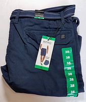 Folded men's navy blue Buffalo David Bitton cargo shorts showing front with attached tag indicating new condition and size 38.