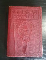 Front cover of the book showing embossed title and portrait of Shakespeare.