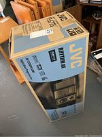 Photo of the original box showing the JVC brand, model F-S77S, and system features like MP3 playback and digital tuning.