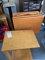 Three solid maple TV tables and one chair side table shown from above and side views.