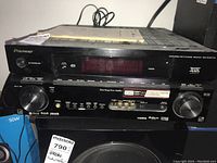 Front view of the Pioneer VSX-9120TXH receiver showing labeling, controls, digital display and branding.