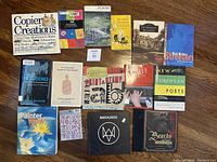 Full layout of 17 books including copier art, poetry, humor, and art topics