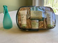 Photo of the full gift basket featuring body cream, hand cream, soap, spritzer, gloves, and trowel