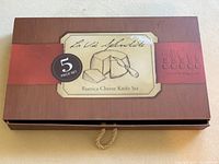 Closed box of Rustica Cheese Knife Set, a 5-piece set in brown packaging with vintage-style label.