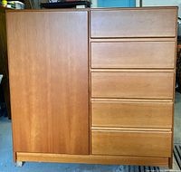 Front view of entire chest showing left cabinet door and right drawer stack