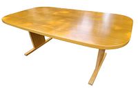 Front perspective showing table shape, base, and overall condition.