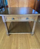 Front view of the Henredon walnut side table showing drawer and lower shelf