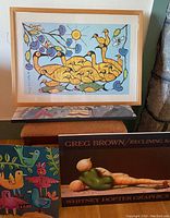 Framed stylized birds print with multiple colorful birds and fish near a sun