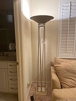 Full view of the 6 foot tall Grecian style floor lamp with a square open base and tall slender vertical rods raising up to the bowl-shaped shade.