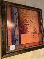 Frontal view of the framed colorful wall art painting, showing abstract nature elements with tall grasses and flowers in warm tones.