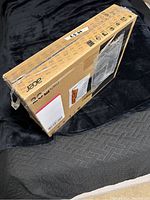 Photo of Acer VX Series monitor retail box showing side and top with shipping labels and taped closed.