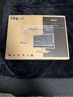 Box front showing Acer 19-inch HD LED Monitor V6 Series with 18.5-inch widescreen display image and product details.
