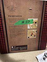 Box for Pichenotte carrom board game with game description and images