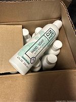 Top view of multiple hand soap bottles with visible label showing brand Noemi and aloe vera ingredient