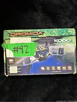Front of the Dromida Kodo micro drone box showing branding and features including micro quad with camera, LED lights, and 2.4 GHz radio control.