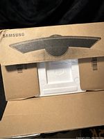 Open cardboard packaging showing molded foam insert and top flaps