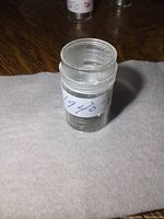 Plastic tube containing the coins, labeled '1940's 12'