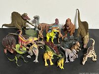 Overview of all dinosaur figures showing variety and size