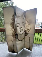 Front side of the 3-panel folding wall divider featuring a black and white image of Marilyn Monroe.