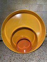 Nesting view of all three melamine trays in retro 'Summer' color scheme showing size and color differences