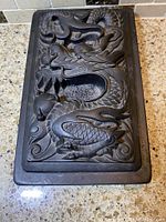 Top view of lid showing raised dragon carving