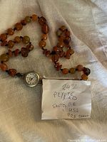 Full view of vintage necklace with integrated watch and note stating 24" Peyote Bird Sante Fe USA 925 clasp