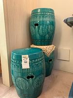 Three stools grouped against wall, showing full set