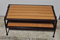 Two-tier wooden slat and metal frame shoe rack with visible wood grain and black metal legs and frame.