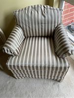 Front view of the gold striped Ethan Allen armchair showing the upholstery, arm covers, and cushion detail.