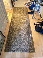 Full view of carpet runner laid on floor showing overall pattern and size
