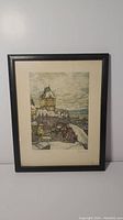 Framed aquatint artwork depicting Quebec City with snow from the Citadel view, showing entire framed piece.